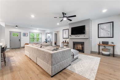 The gas fireplace is the central focus of the living room with a large comfy sofa to relax on.