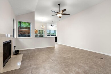 Unfurnished living room featuring a premium firep