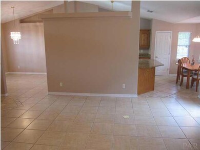 View of family room. You will notice the cathedral ceiling throughout the common living areas.