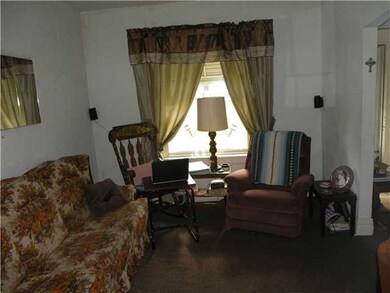 Living Room. Covered front porch to Lower entrance