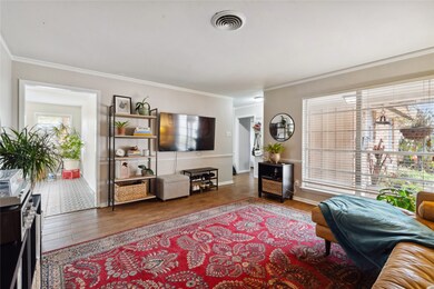 The neutral-toned walls and polished wood floors e