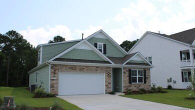 Craftsman house with a front lawn