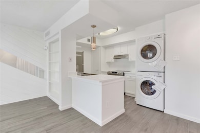 Beautiful Renovations include Porcelain Wood look Flooring & Quartz Countertops w/Full Size Front Loader Washer & Dryer Included!