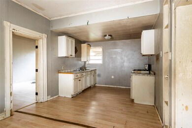 Kitchen featuring sink and light hardwood / wood-s
