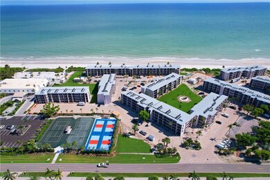 Drone / aerial view featuring a water view and a v
