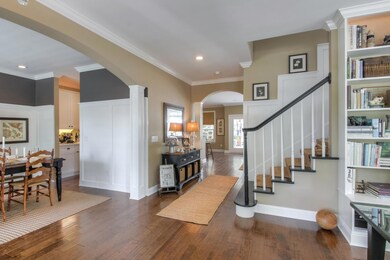 The floor plan of this home flows so nicely due to the hand scraped wood flooring throughout the main living spaces downstairs.
