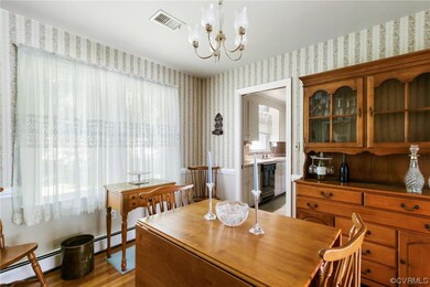 Wood floored dining space featuring a wealth of na