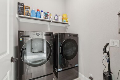 Utility room with additional built-in shelves and 