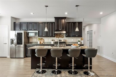 Large kitchen is a chef's dream! EVP flooring, rec
