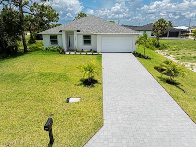 Ranch-style home with an attached garage, a front