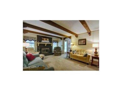 Wood burning fireplace finishes off this cozy spac