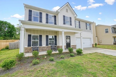 View of front of property featuring board and batt