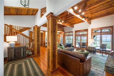 Living room with wood finished floors, wooden ceil
