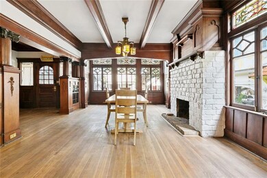Dining room with fireplace mantel and paned window