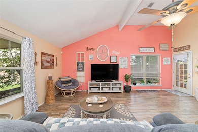 Open family room with vaulted ceilings.