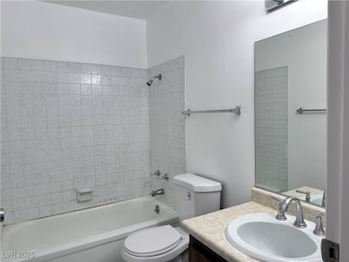 Bathroom with vanity and shower / washtub combinat