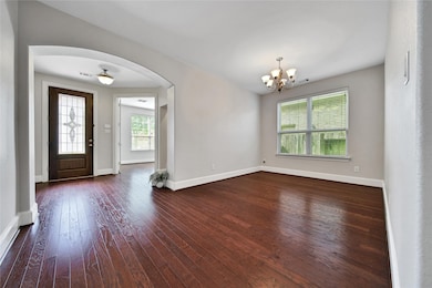 Wood floors grace the entry of this home the flex