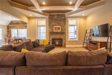 This amazing home features coffered ceilings, gas fireplace, stone and wood pillars that accent the Open but structured concepts of room divisions between the main the living areas.