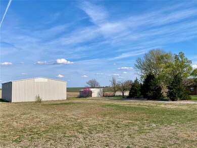 View of yard featuring shop and 4 acres mol
