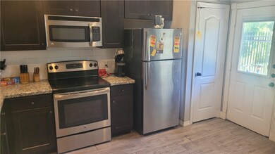 Kitchen with appliances with stainless steel finis