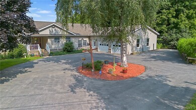 Convenient circular driveway separated by landscap