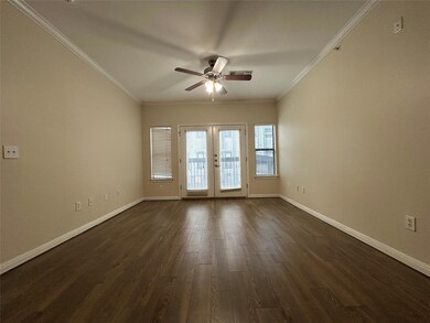 Empty room featuring ceiling fan, french doors, d