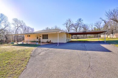 View of front of property with a front lawn, an at