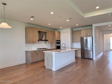 Large kitchen island with farmhouse sink and Kohle