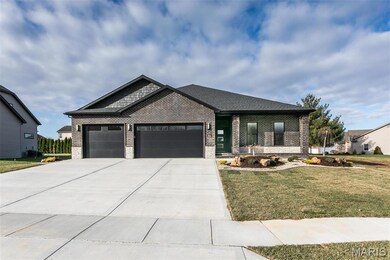 View of front facade with a front yard, a garage, and central AC unit