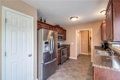 You will love this kitchen.  Nice cabinetry, plenty of counter space and pantry.  All stainless steel appliances.  Three door refrigerator remains with home along with washer & dryer.  Nothing to buy; just move in and enjoy!