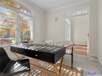 Front office with elegant transom detail and large arched window overlooking the front yard.