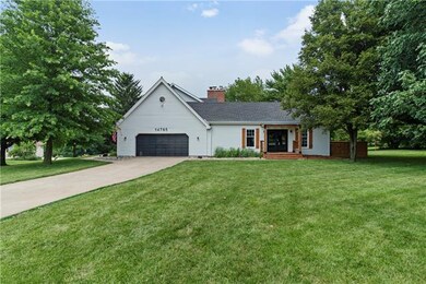 Oversized two car garage and separate driveway and a pergola covered porch with entry into great room.