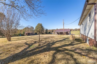 View of green lawn with an outdoor structure