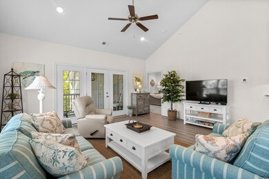 Living room featuring french doors, visible vents,
