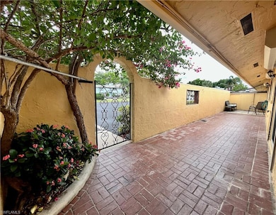 View of patio with a gate