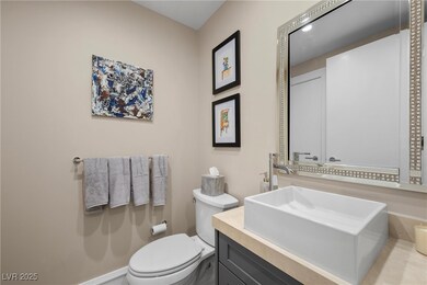 Half bath featuring vanity and toilet