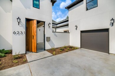 Beautiful pivoting doorway to private courtyard.