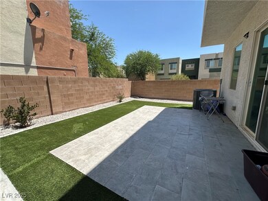Fenced backyard with a patio area