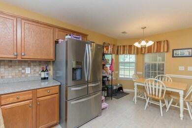 Kitchen with laminate countertops and coordinating back splash.