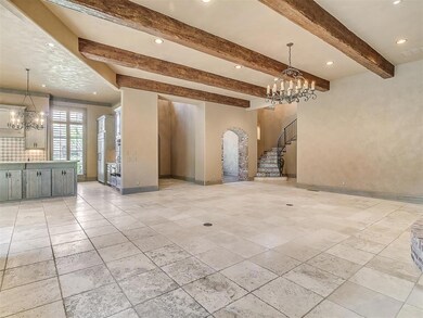 Lliving room featuring light tile flooring, a nota