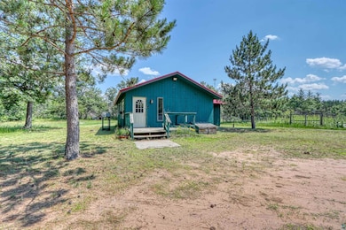 Back of property featuring a yard