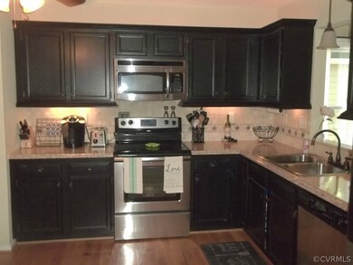 Newer stainless steel appliances, counters, tile b