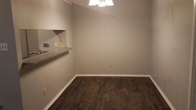 Unfurnished dining area with dark wood-type floor