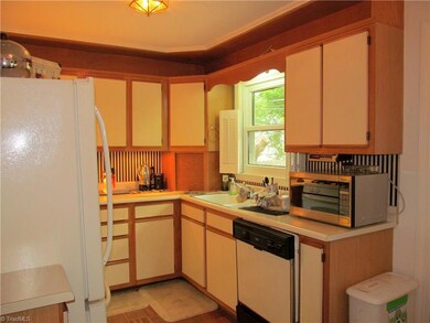 Kitchen window overlooks private back yard