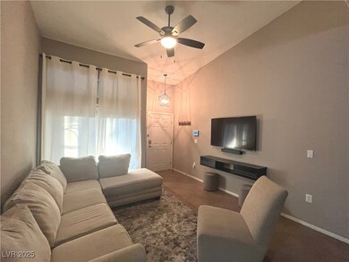 Family room with vaulted ceilings, ceiling fan & light that opens to the dining area and kitchen.