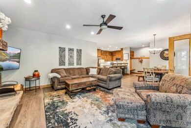 Living room with light hardwood / wood-style floor