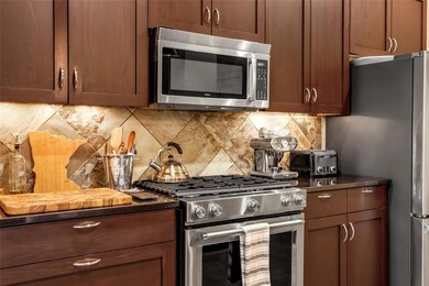 Kitchen featuring appliances with stainless steel