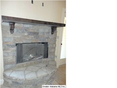 Rock Fireplace with Raised Hearth