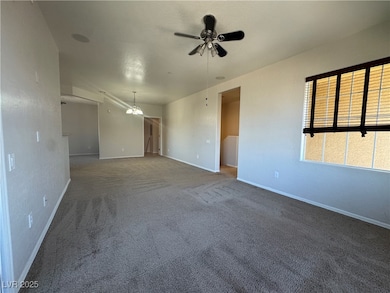 Carpeted spare room with baseboards and a ceiling