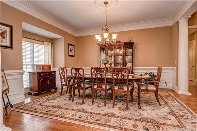 Formal Dining Room with Hardwood Floors, Crown Mol